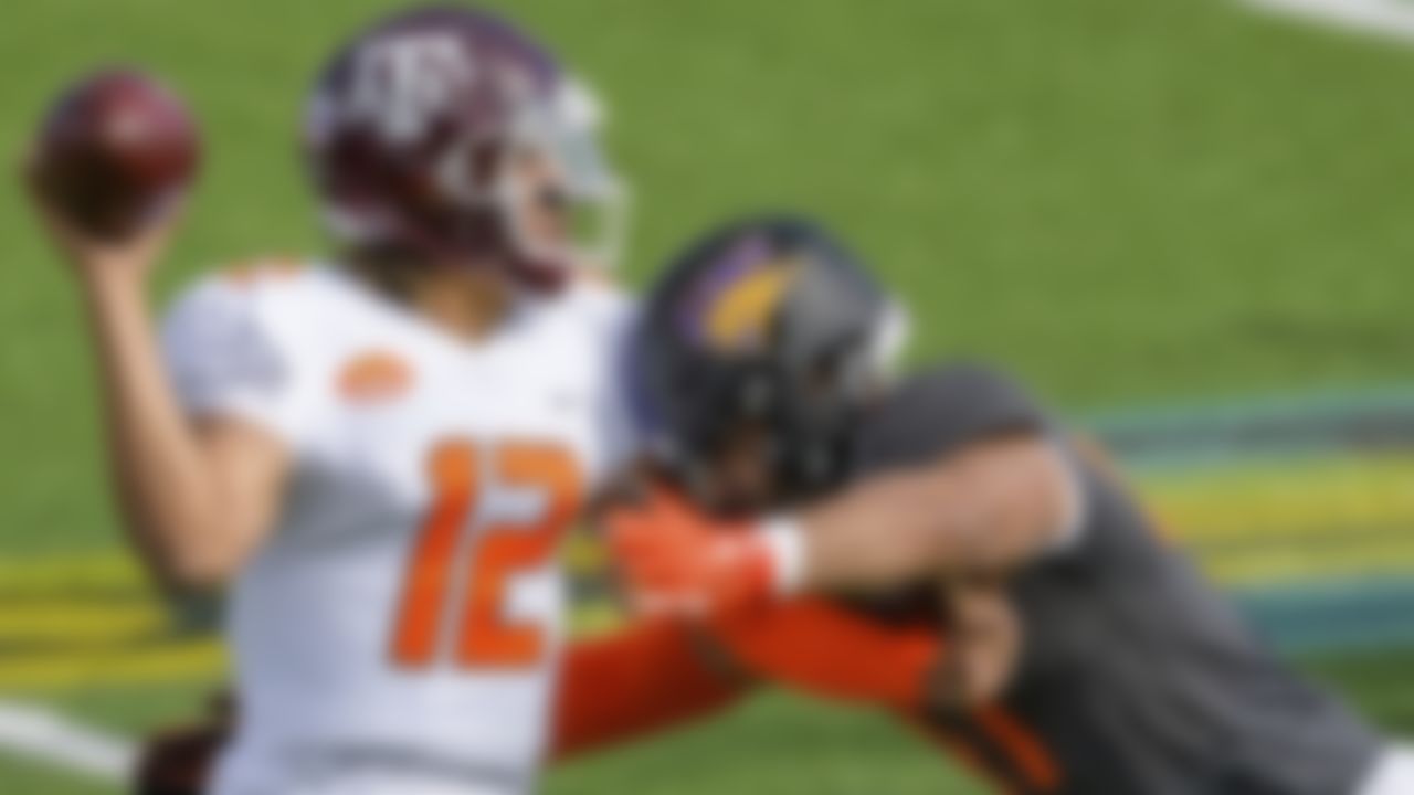 American Team quarterback Kellen Mond of Texas A&M (12) throws against National Team offensive lineman Spencer Brown of Northern Iowa (FCS) (76) during the NCAA Senior Bowl college football game in Mobile, Ala., Saturday, Jan. 30, 2021.