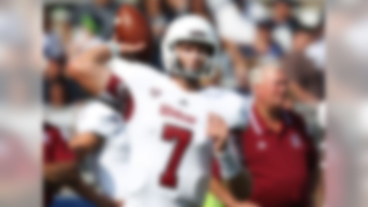 Our quarterback, Blake Frohnapfel -- pronounced FRO-napple -- spent two years at UMass after leaving Marshall. He's a large human (at least for a quarterback) at 6-foot-6, but he has some issues with turnovers and, as our own Lance Zierlein put it, "stares down targets with white-hot intensity." His last name means "happy apple" in German. I wasn't aware Germans had a word for happy. Good for them.