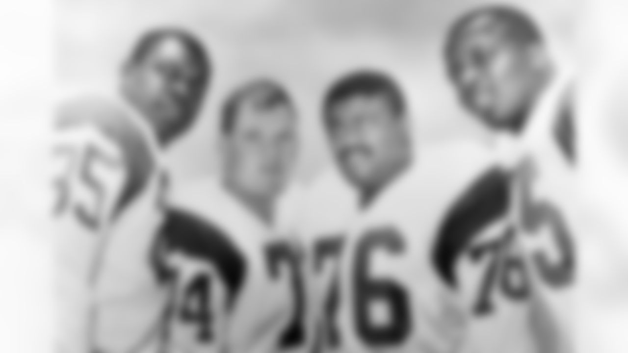 The Los Angeles Rams defensive front four, known as the "Fearsome Foursome", pose together in 1964. Pictured left to right are defensive end Lamar Lundy (85), Hall of Fame defensive tackle Merlin Olsen (74), defensive tackle Rosey Grier (76), and Hall of Famer Deacon Jones. (National Football League)