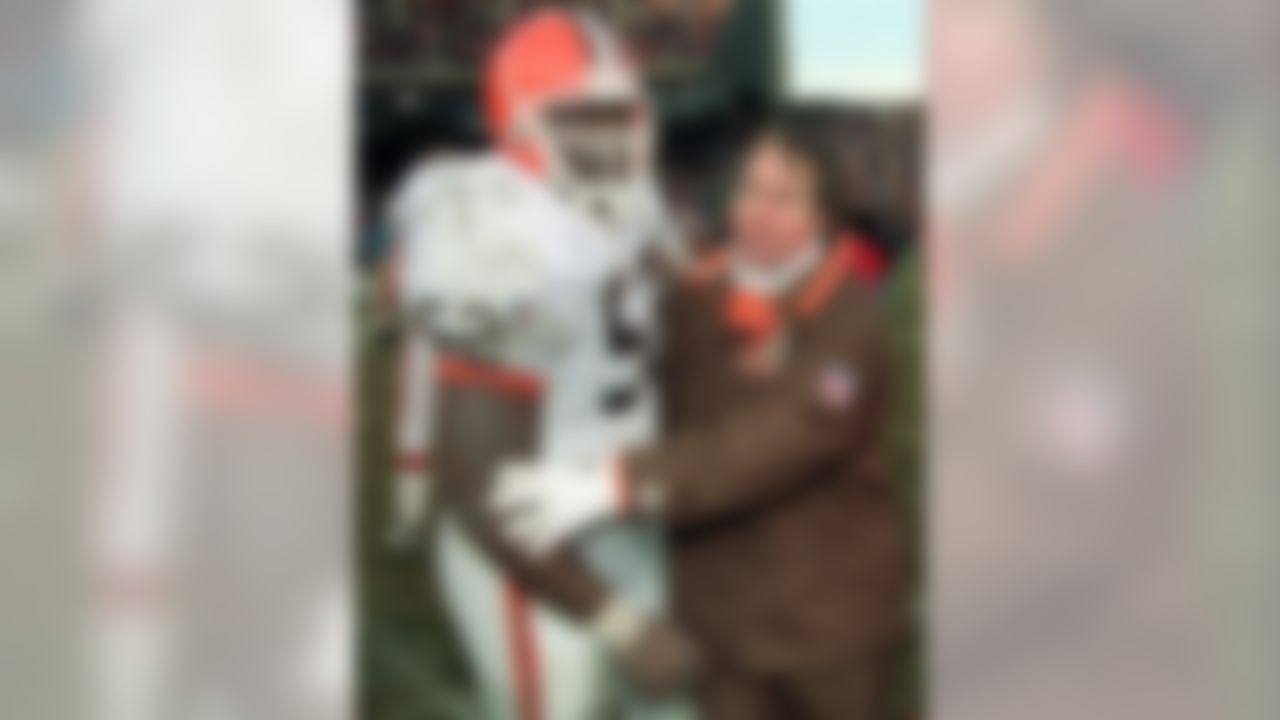 Cleveland Browns head coach Bill Belichick congratulates linebacker Pepper Johnson (52) after the Browns' 26-10 win over the Cincinnati Bengals on Sunday, Dec. 17, 1995, in Cleveland Stadium. Belichick admitted Monday he spent a few extra minutes on the field after the game reflecting on the history of the old stadium that has probably seen its last Cleveland Browns game. (AP Photo/Mark Duncan)