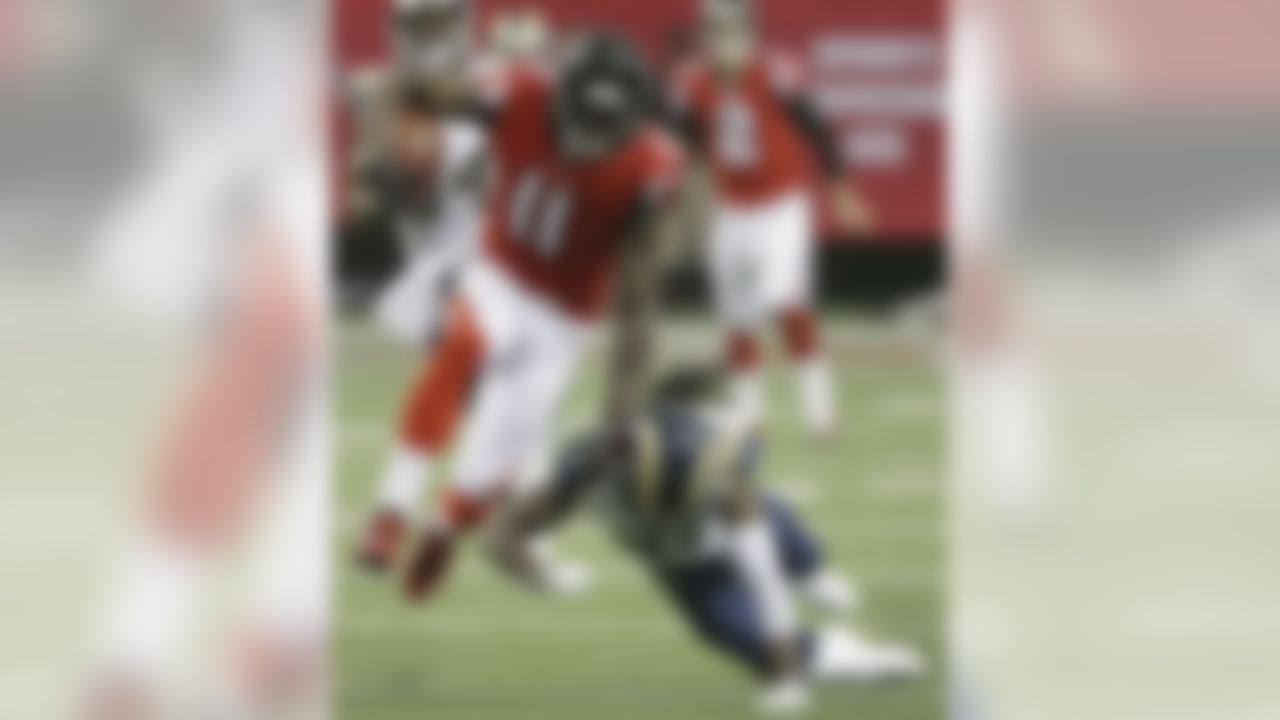 Atlanta Falcons wide receiver Julio Jones (11) moves past St. Louis Rams cornerback Janoris Jenkins (21) during the first half of an NFL football game, Sunday, Sept. 15, 2013, in Atlanta. (AP Photo/John Bazemore)