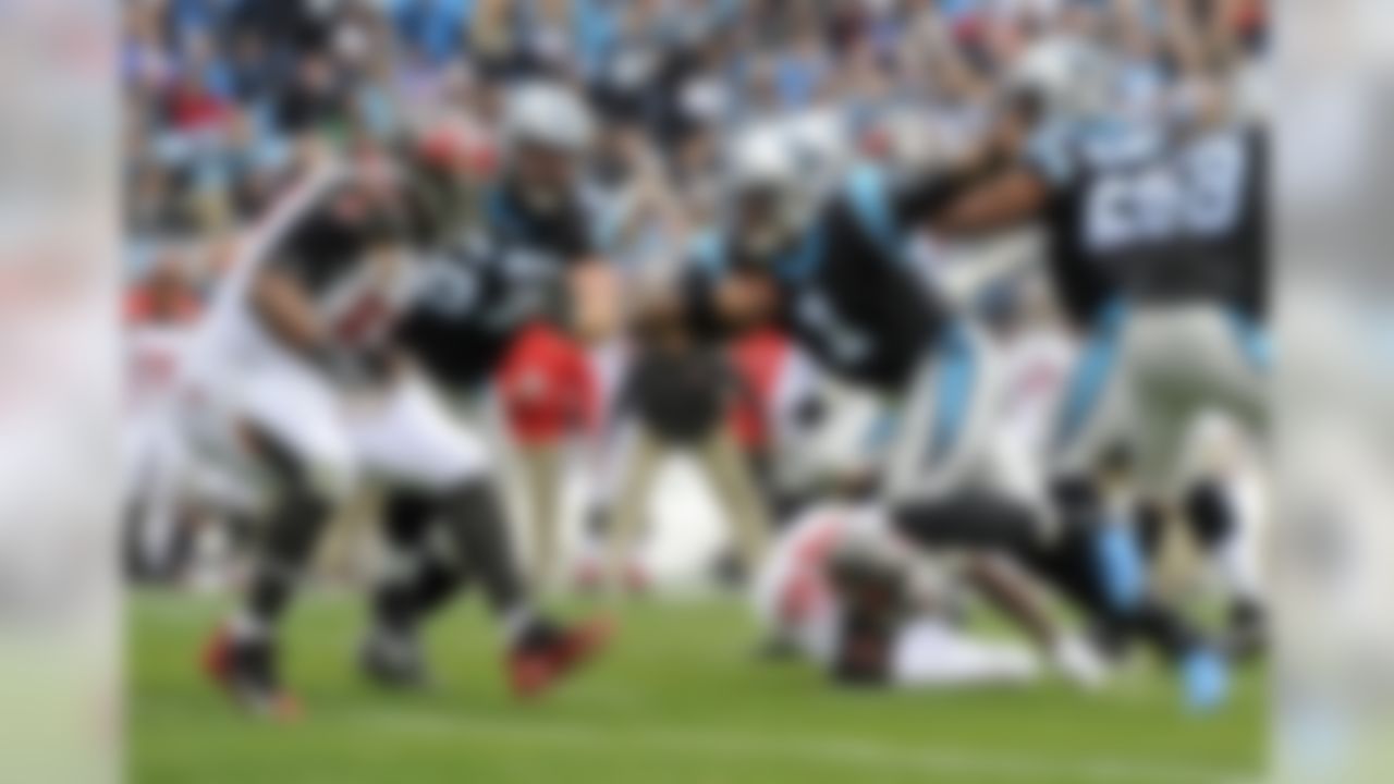 Carolina Panthers' Cam Newton (1) runs as Tampa Bay Buccaneers' Gerald McCoy (93) defends during the first half of an NFL football game in Charlotte, N.C., Sunday, Dec. 24, 2017. (AP Photo/Mike McCarn)