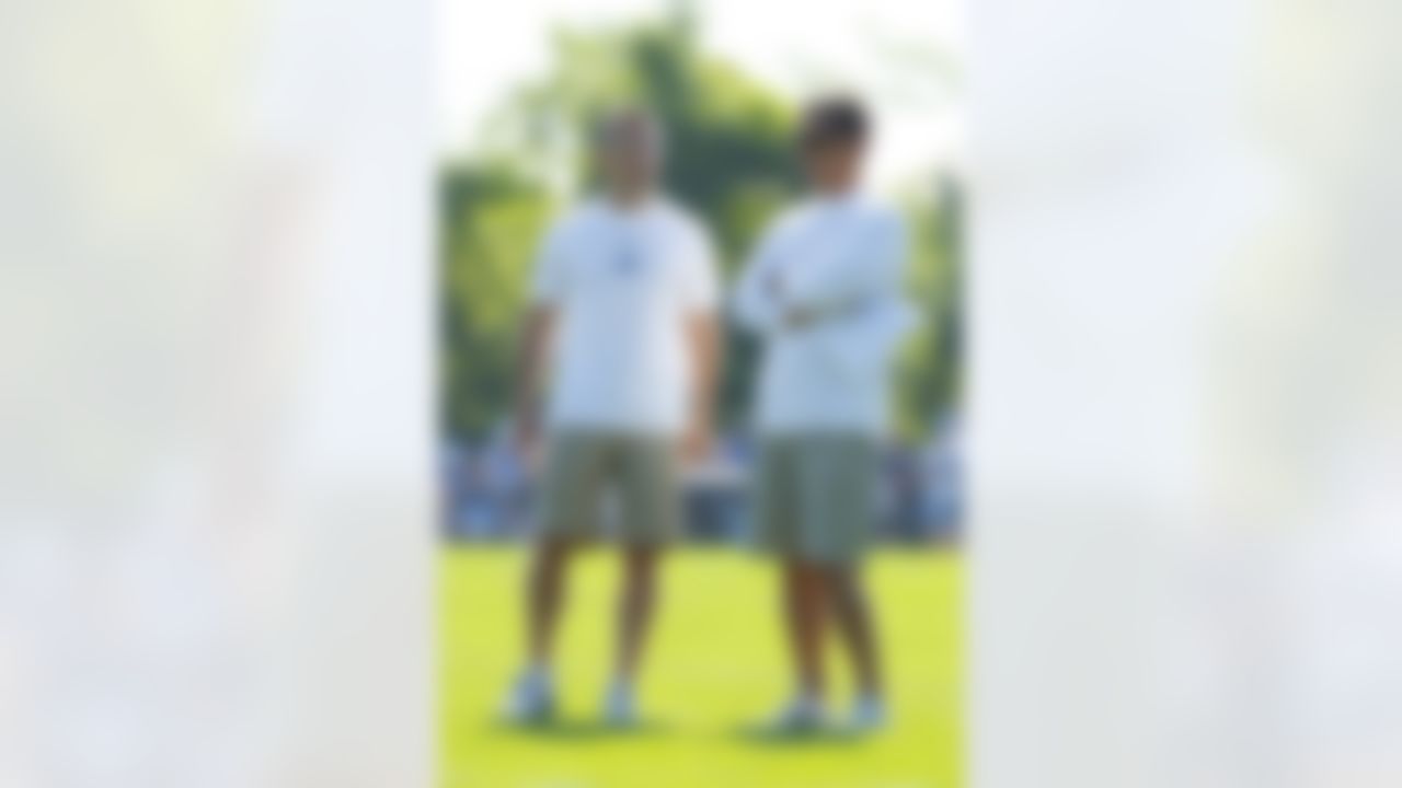 Detroit Lions President Tom Lewand (right) and head coach Jim Schwartz (left) talk during their NFL football training camp practice at the Detroit Lions training facility in Allen Park, MI, Saturday, July 30, 2011. (AP Photo/Rick Osentoski)