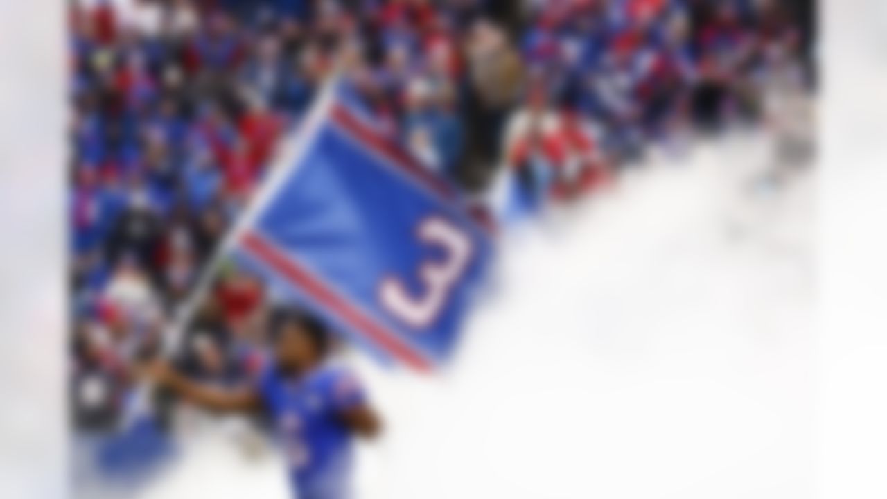 Buffalo Bills wide receiver Isaiah McKenzie (6) carries a flag displaying the number 3 in the support of safety Damar Hamlin before an NFL football game against the New England Patriots, Sunday, Jan. 8, 2023, in Orchard Park, N.Y. Hamlin remains hospitalized after suffering a catastrophic on-field collapse in the team's previous game against the Cincinnati Bengals.
