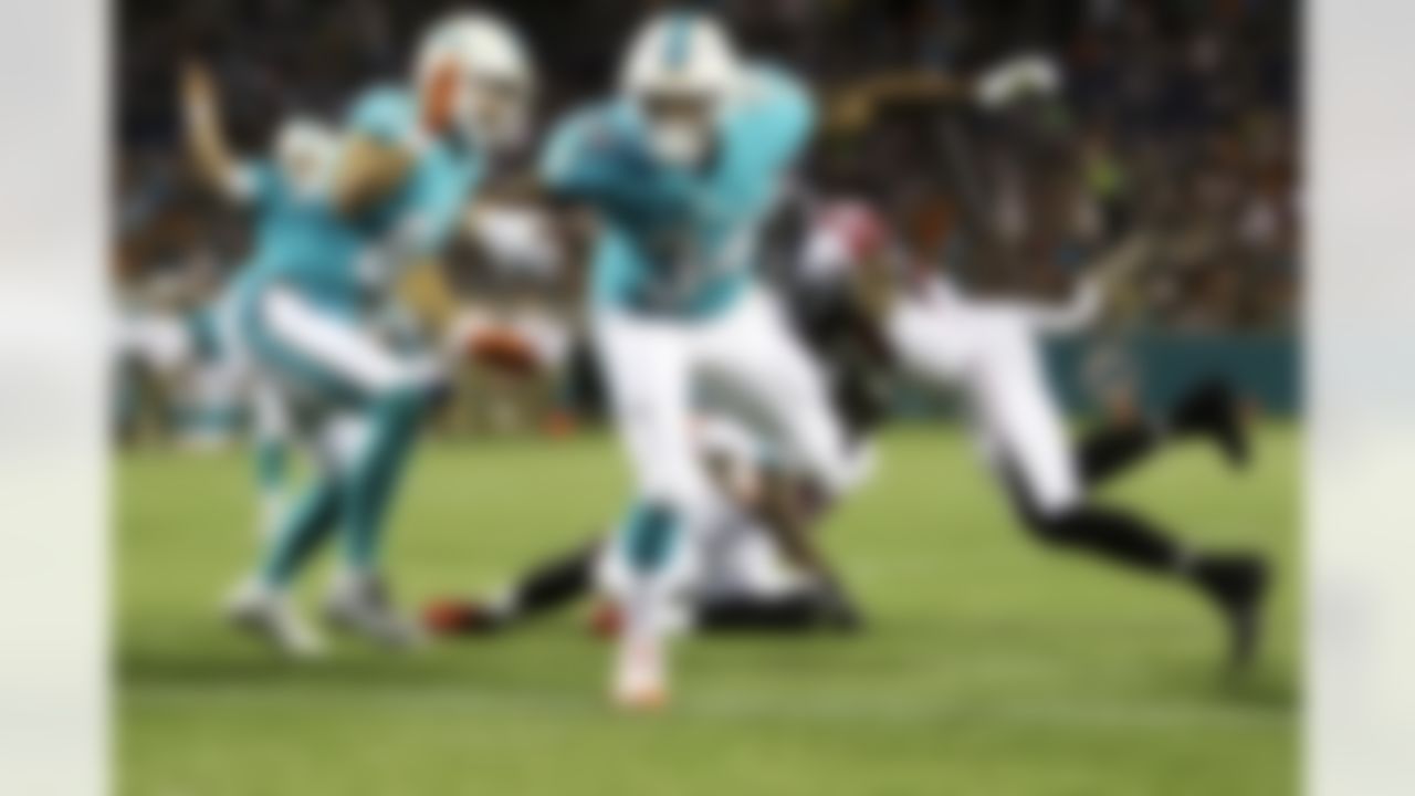 Miami Dolphins running back Arian Foster (34) runs the ball for a touchdown in the first half of a preseason game as Atlanta Falcons free safety Ricardo Allen (37) defends, Thursday, Aug. 25, 2016 in Orlando,Fla. The Miami Dolphins dolphins won 17-6. (Logan Bowles/NFL)