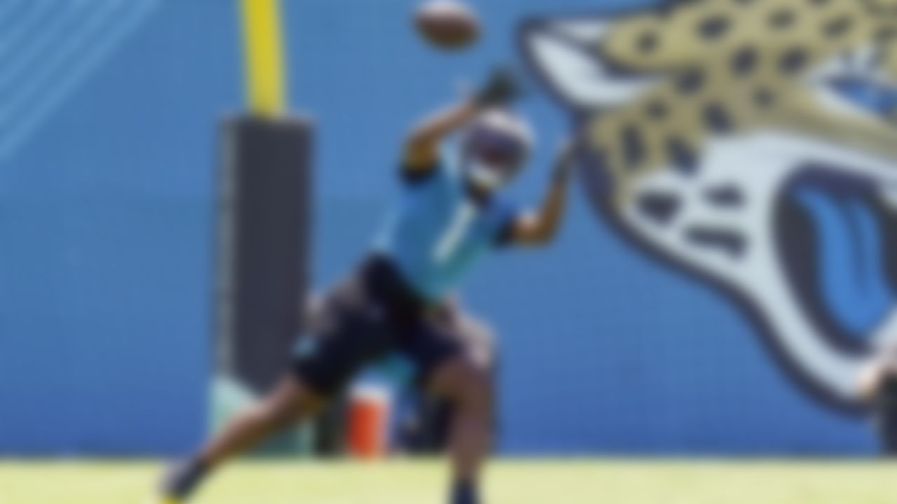 Jacksonville Jaguars running back Travis Etienne Jr. (1) catches a pass during a drill at NFL football rookie minicamp, Saturday, May 15, 2021, in Jacksonville, Fla.