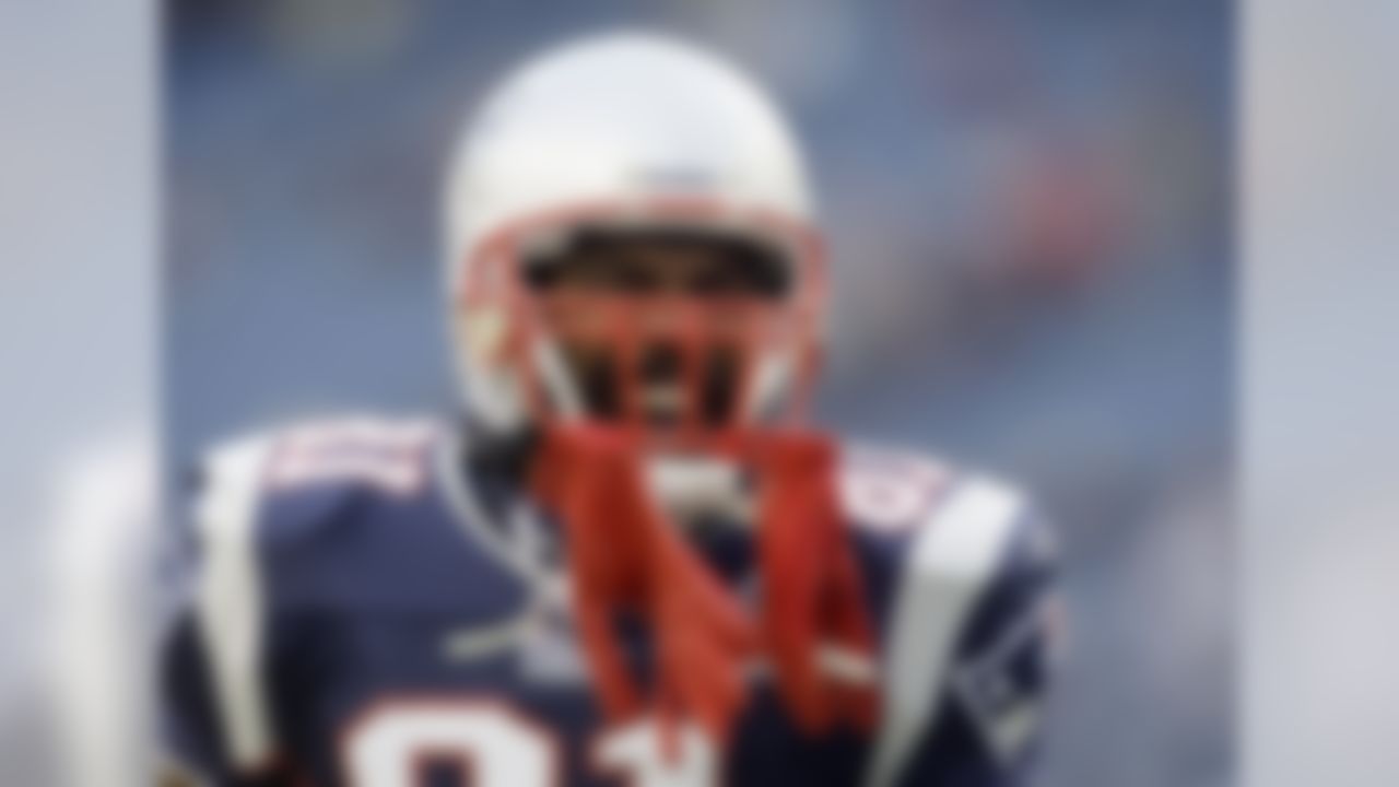 New England Patriots wide receiver Randy Moss laughs during warmups before an NFL football game against the New York Jets in Foxborough, Mass., Sunday Nov. 22, 2009. (AP Photo/Elise Amendola)