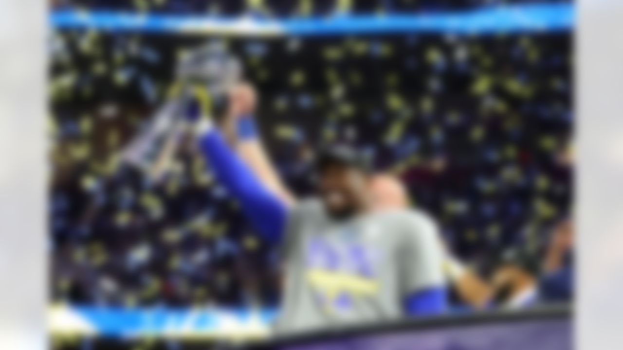 Los Angeles Rams outside linebacker Von Miller (40) hoists the Vince Lombardi Trophy after Super Bowl LVI on Sunday, February 13, 2022 in Inglewood, California.