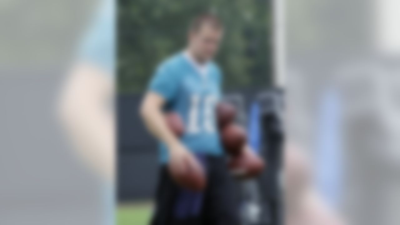 Jacksonville Jaguars kicker Josh Scobee, with an armload of footballs, prepares for kicking drills during football workouts in Jacksonville, Fla., Monday, June 7, 2010.(AP Photo/John Raoux)