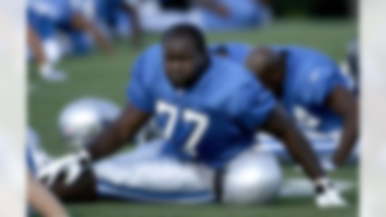 ALLEN PARK, MI - JULY 24: Gosder Cherilus #77 of the Detroit Lions stretches during training camp at the Detroit Lions Headquarters and Training Facility on July 24, 2008 in Allen Park, Michigan. (Photo by Gregory Shamus/Getty Images)