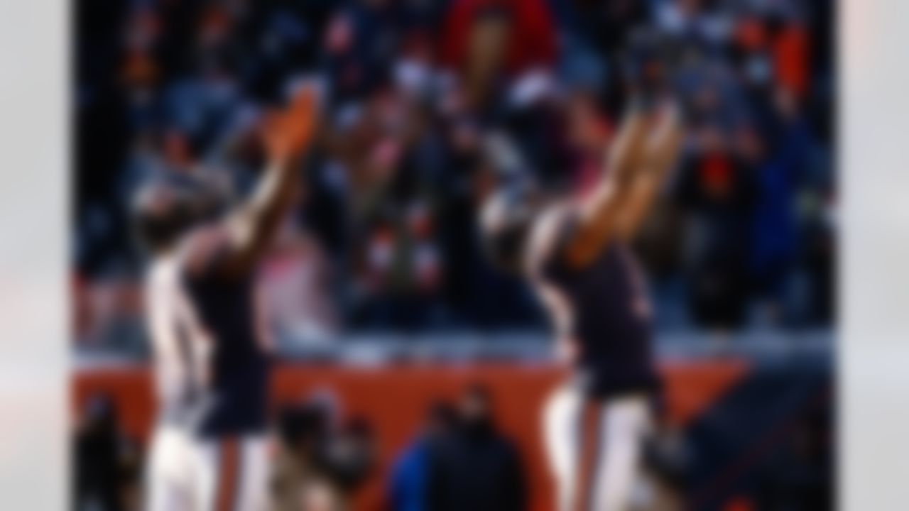 Chicago Bears running back David Montgomery (32) and wide receiver Marquise Goodwin (84) celebrate a touchdown during an NFL football game against the New York Giants on Sunday, January 2, 2022 in Chicago, Illinois.