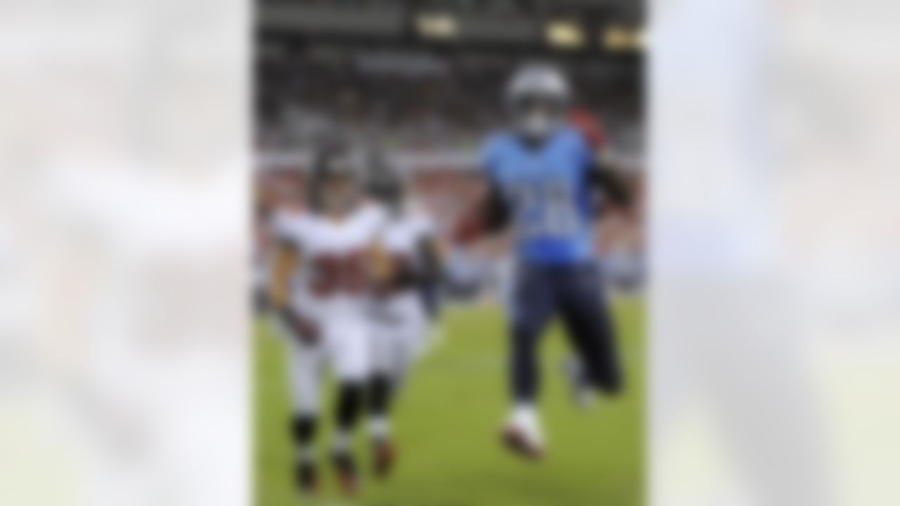 Tennessee Titans running back Chris Johnson (28) scores a second-quarter touchdown after getting past Tampa Bay Buccaneers defensive backs Cody Grimm (35) and Ahmad Black (43) during an NFL preseason football game Friday, Aug. 17, 2012, in Tampa, Fla. (AP Photo/Brian Blanco)