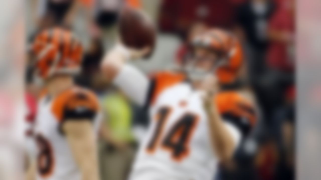 Cincinnati Bengals quarterback Andy Dalton (14) warms up prior to an NFL preseason football game against the Arizona Cardinals, Sunday, Aug. 24, 2014, in Glendale, Ariz. (AP Photo/Matt York)