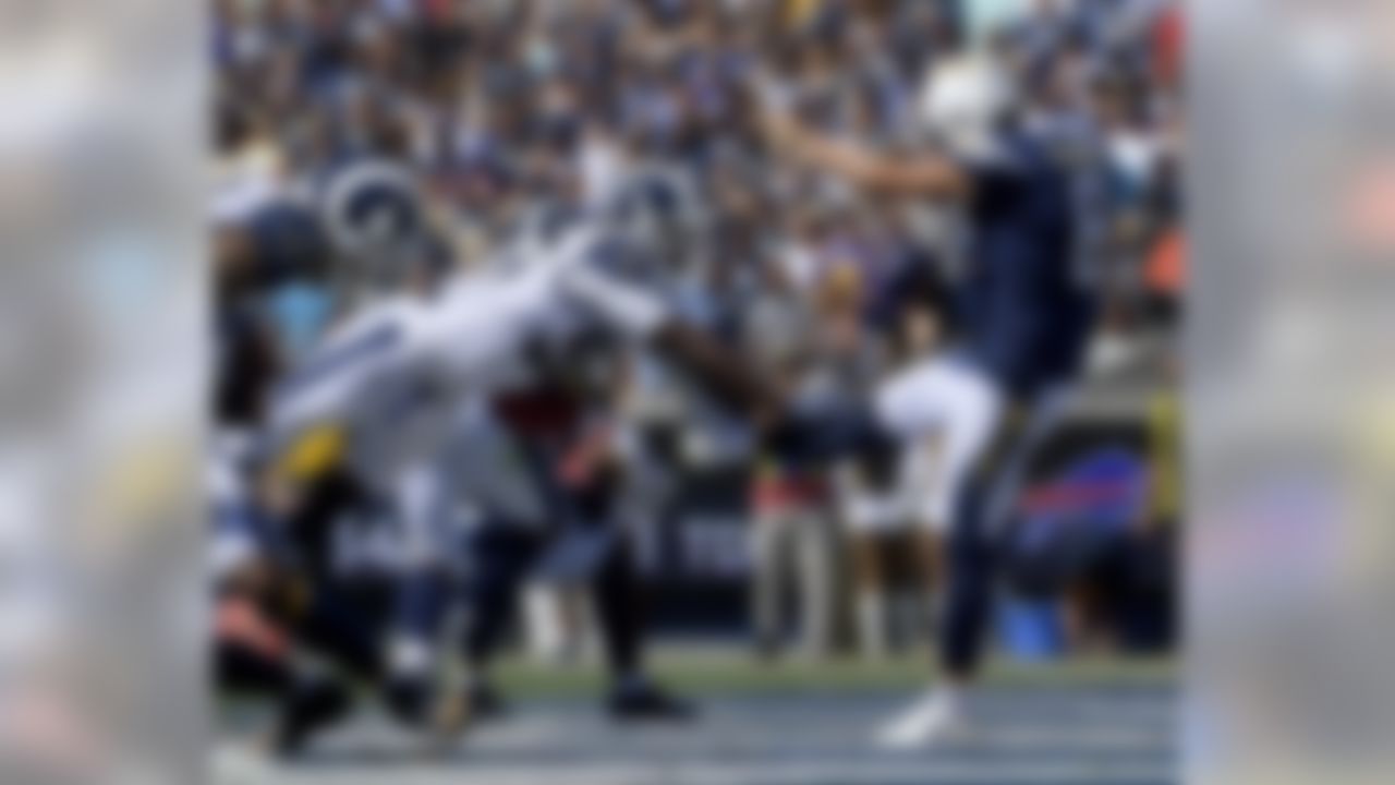 Los Angeles Rams linebacker Cory Littleton blocks a punt by Los Angeles Chargers punter Drew Kaser in the end zone during the first half in an NFL football game Sunday, Sept. 23, 2018, in Los Angeles. (AP Photo/Mark J. Terrill)