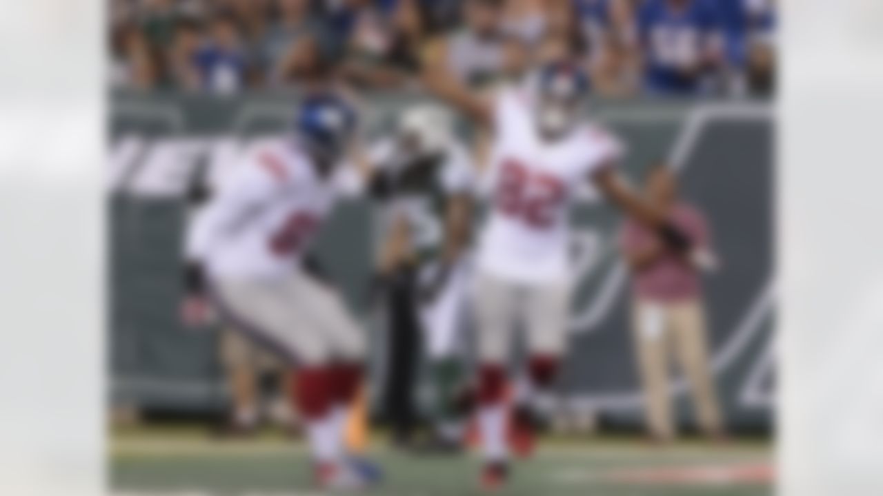 New York Giants wide receiver Rueben Randle (82) celebrates with tight end Adrien Robinson (81) after catching a touchdown pass against the New York Jets in the second quarter of a preseason NFL football game, Friday, Aug. 22, 2014, in East Rutherford, N.J. (AP Photo/Julio Cortez)