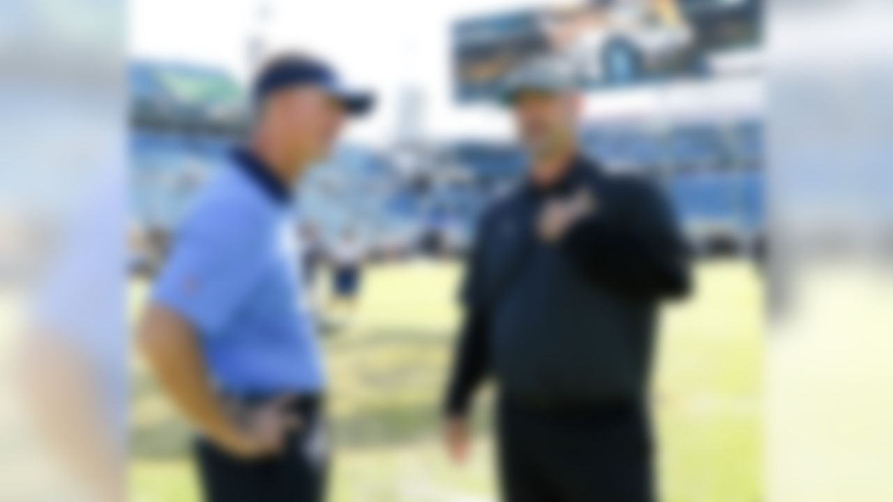 San Diego Chargers head coach Mike McCoy, left, and Jacksonville Jaguars head coach Gus Bradley talks on the field before an NFL football game in Jacksonville, Fla., Sunday, Nov. 29, 2015. (AP Photo/Stephen B. Morton)