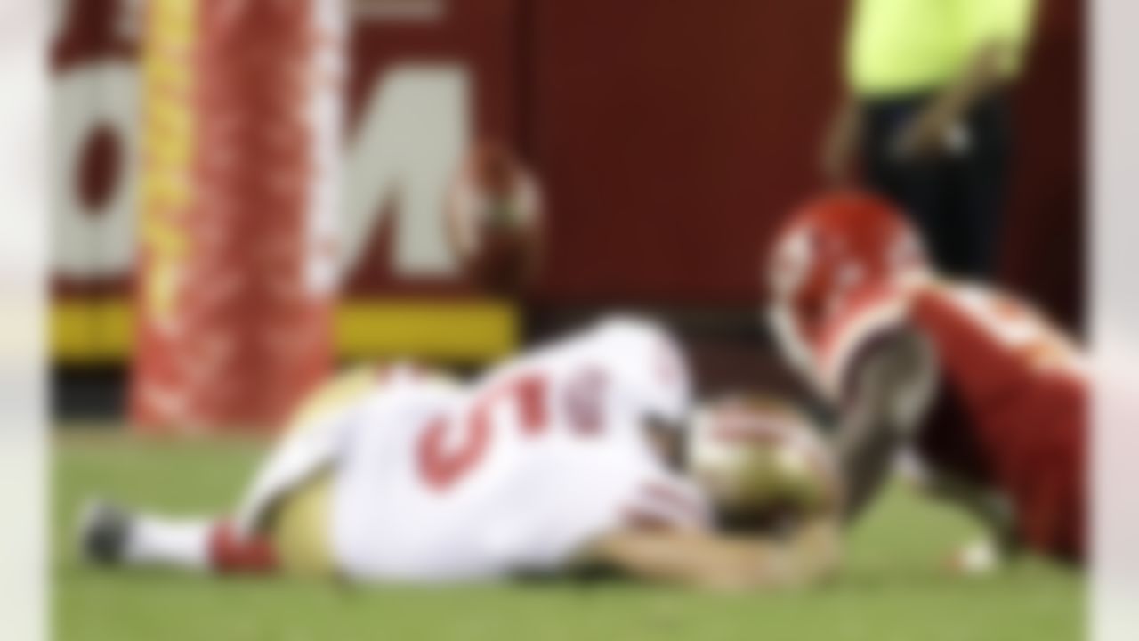 Kansas City Chiefs linebacker Kevin Pierre-Louis (57) scrambles for the ball after blocking a punt by San Francisco 49ers' Bradley Pinion (5)], during the second half of an NFL preseason football game in Kansas City, Mo., Friday, Aug. 11, 2017. (AP Photo/Charlie Riedel)