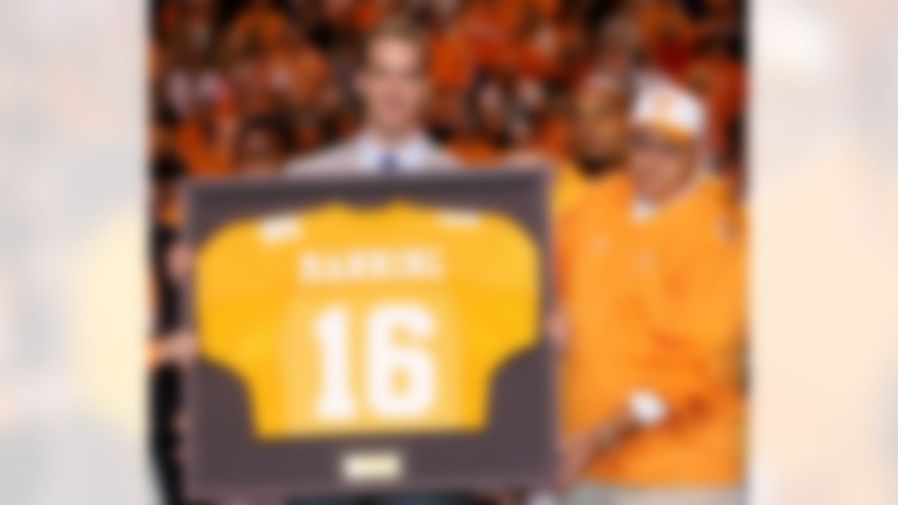 KNOXVILLE, TN - OCTOBER 29: Former Tennesse quarterback Peyton Manning and current quarterback for the Indianapolis Colts is honored alongside his former college coach Phillip Fulmer before the start of the game against the South Carolina Gamecocks on October 29, 2005 at Neyland Stadium in Knoxville, Tennessee. (Photo by Streeter Lecka/Getty Images)