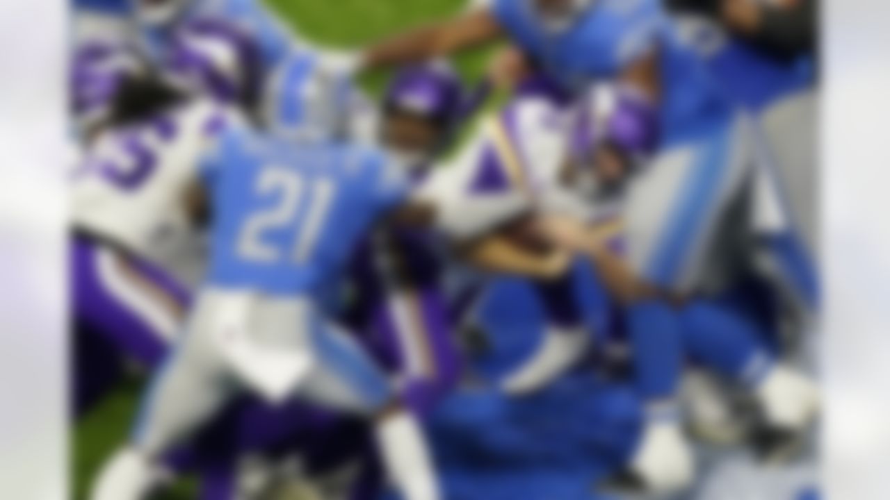 Minnesota Vikings quarterback Kirk Cousins (8) crosses the goal line for a 1-yard touchdown during the second half of an NFL football game against the Detroit Lions, Sunday, Jan. 3, 2021, in Detroit.