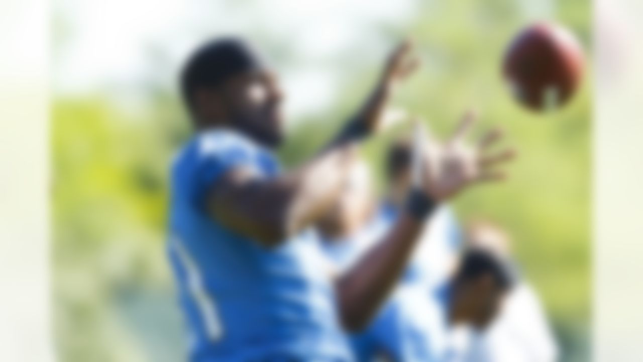Detroit Lions wide receiver Calvin Johnson (81) makes a catch during NFL football training camp at the team's practice facility in Allen Park, Mich., Saturday, July 30, 2011. (AP Photo/Rick Osentoski)