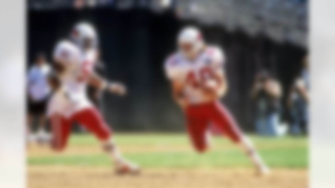 Arizona Cardinals defensive back Pat Tillman (40) returns an interception during an NFL game against the Oakland Raiders on Sunday, Aug. 29, 1998, in Oakland. The Cardinals won the game, 21-14. (AP Photo/Greg Trott)