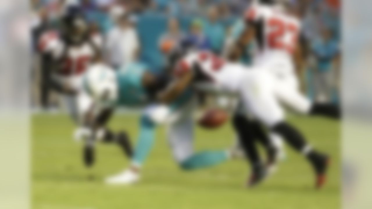 Miami Dolphins wide receiver Jarvis Landry (14) drops a pass as Atlanta Falcons cornerback Ricardo Allen (37) defends during the first half of a preseason NFL football game, Saturday, Aug. 29, 2015, in Miami Gardens, Fla. (AP Photo/Lynne Sladky)