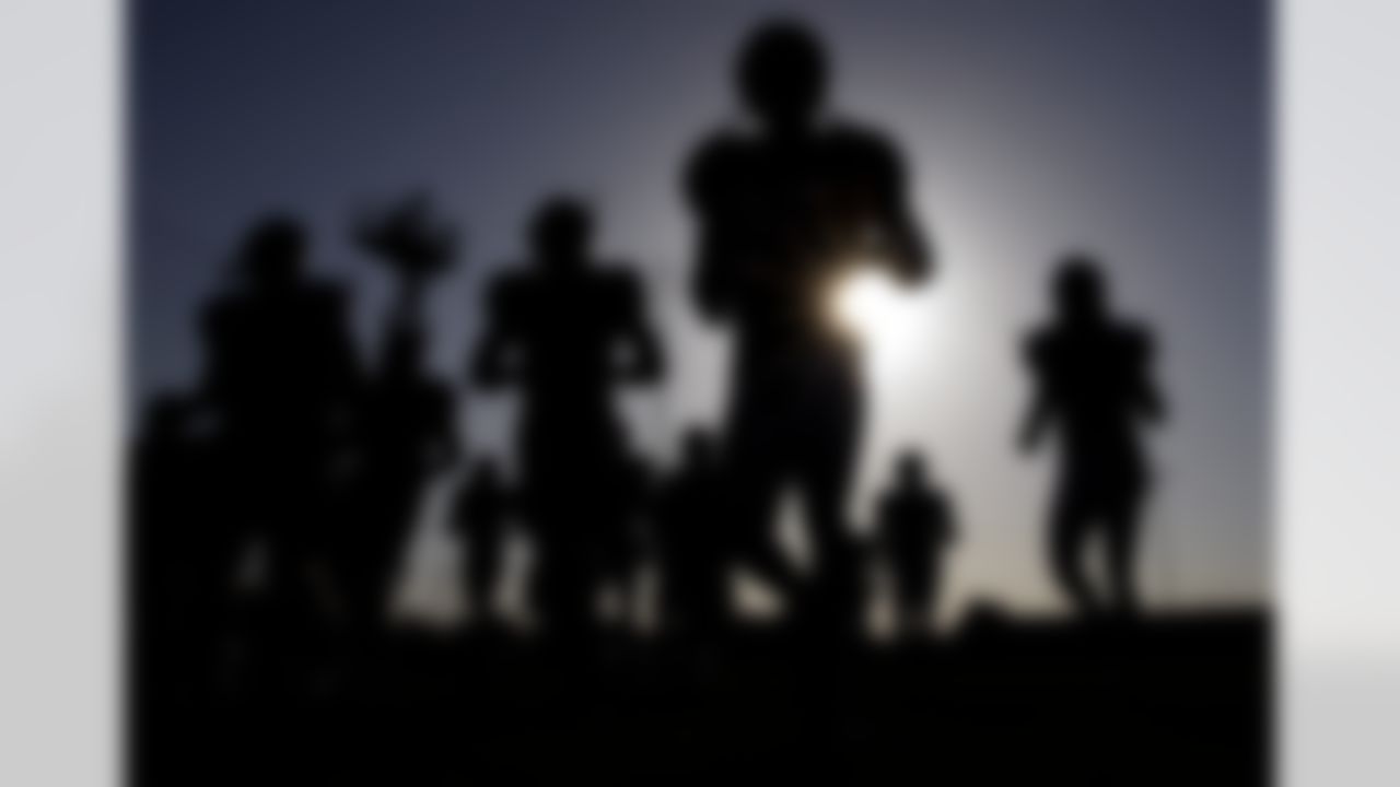 Houston Texans players make their way to a practice field during a NFL football training camp practice Monday, Aug. 2, 2010 in Houston. (AP Photo/David J. Phillip)