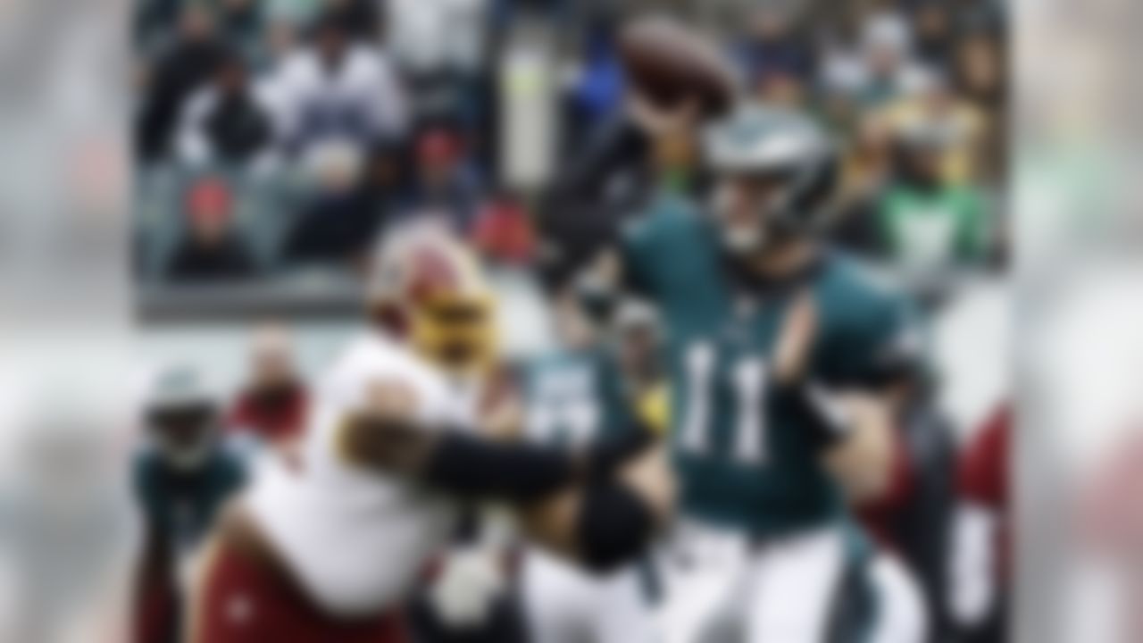Philadelphia Eagles' Carson Wentz passes during the first half of an NFL football game against the Washington Redskins, Sunday, Dec. 11, 2016, in Philadelphia. (AP Photo/Michael Perez)