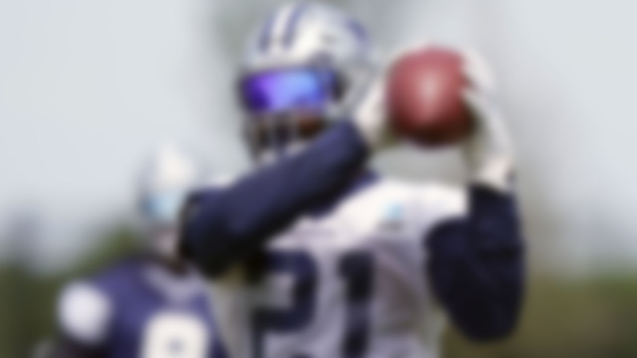 Dallas Cowboys running back Ezekiel Elliott (21) catches during an NFL football team practice Tuesday, June 8, 2021, in Frisco, Texas.