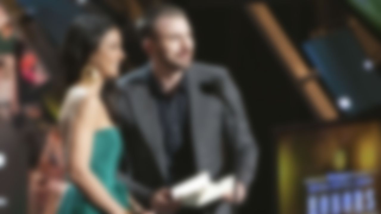 Emmanuelle Chriqui (L) and Chris Evans speak during the inaugural NFL Honors show Saturday, Feb. 4, 2012, in Indianapolis.