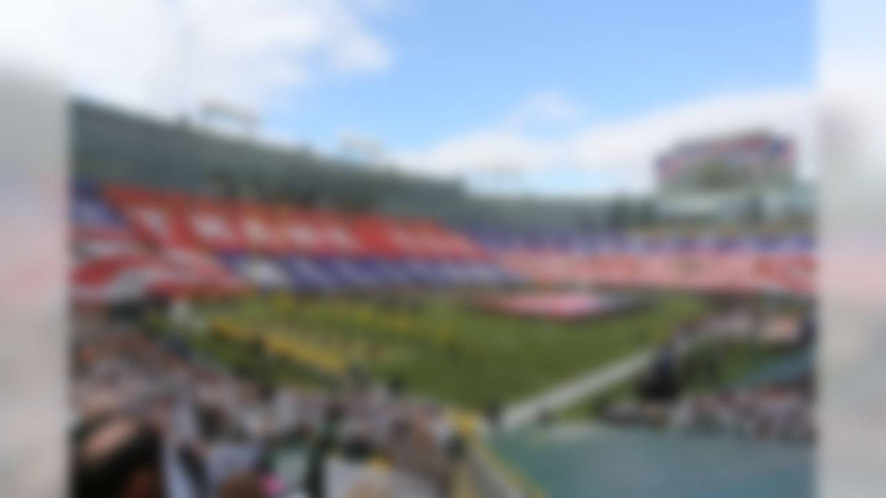 Green Bay Packers fans salute the military before a game against the Arizona Cardinals at legendary Lambeau Field. (Todd Rosenberg/NFL)