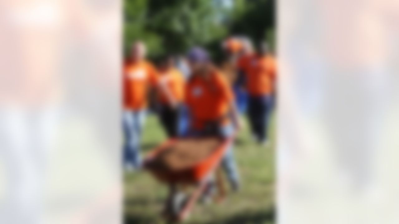 The Home Depot volunteers adding more mulch to the playground. (Photo by Tom Copeland/Home Depot)