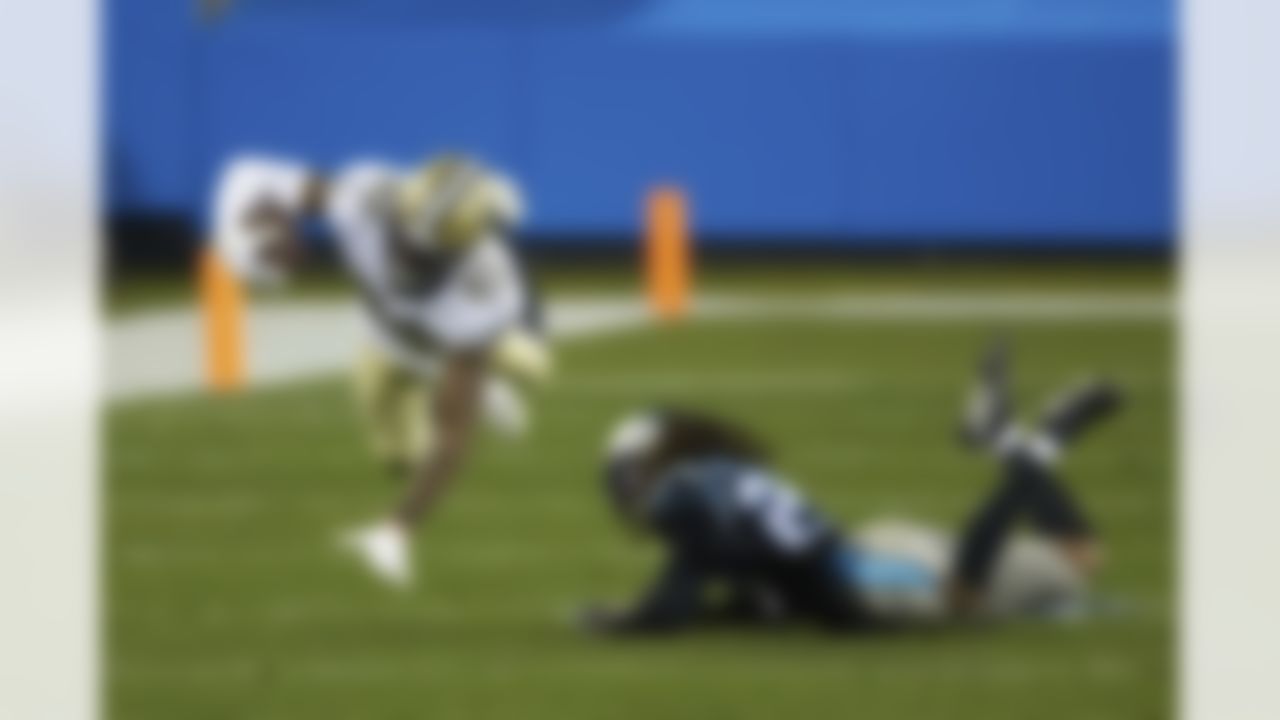 New Orleans Saints wide receiver Juwan Johnson (83) is tripped up by Carolina Panthers cornerback Stantley Thomas-Oliver III (23) during an NFL football game, Sunday, Jan. 3, 2021, in Charlotte, N.C.