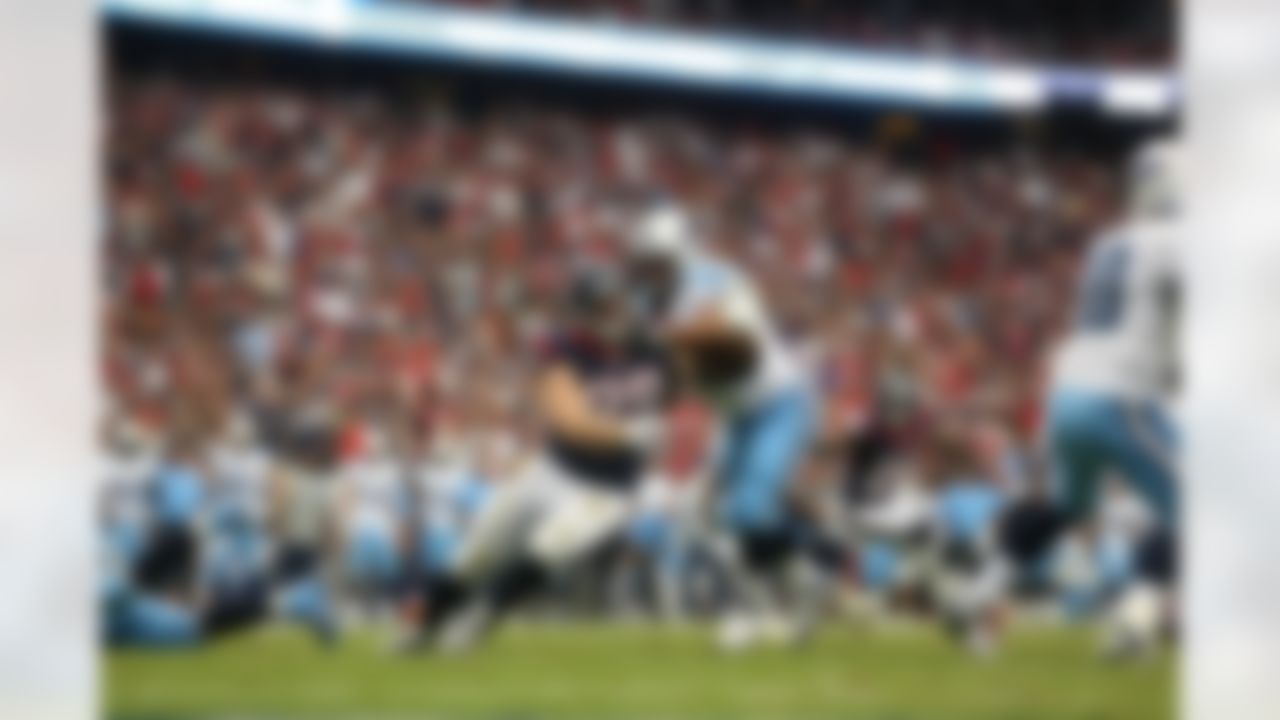 Houston Texans defensive end J.J. Watt (99) runs on the field against the Tennessee Titans during an NFL game in Houston, Texas Sunday, Sept. 30, 2012. (AP Photo/Tom Hauck)