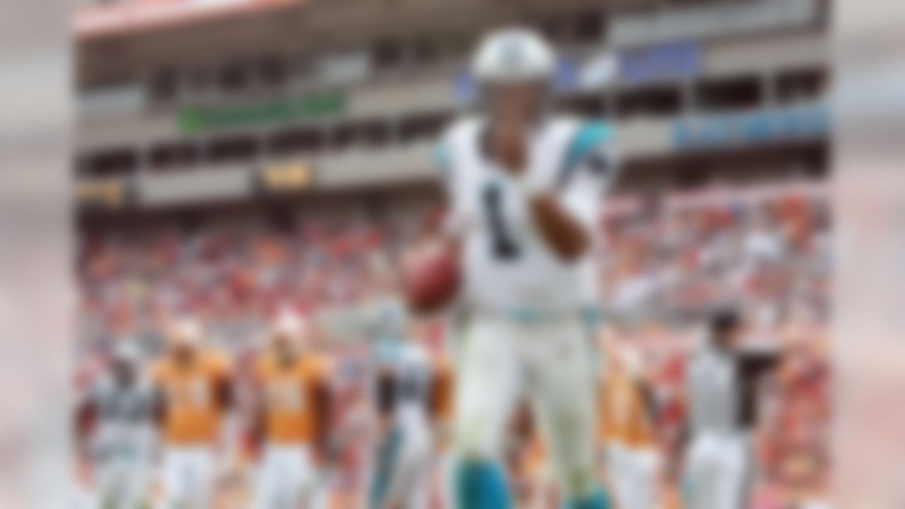 December 4, 2011; Tampa, FL, USA; Carolina Panthers quarterback Cam Newton (1) smiles after he scored a touchdown during the second half against the Tampa Bay Buccaneers at Raymond James Stadium. Carolina won 38-19. Mandatory Credit: Kim Klement-US PRESSWIRE