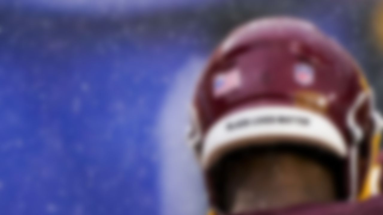 Washington Football Team's Terry McLaurin listens in a huddle as it rains during the second half of an NFL football game against the Los Angeles Rams Sunday, Oct. 11, 2020, in Landover, Md.