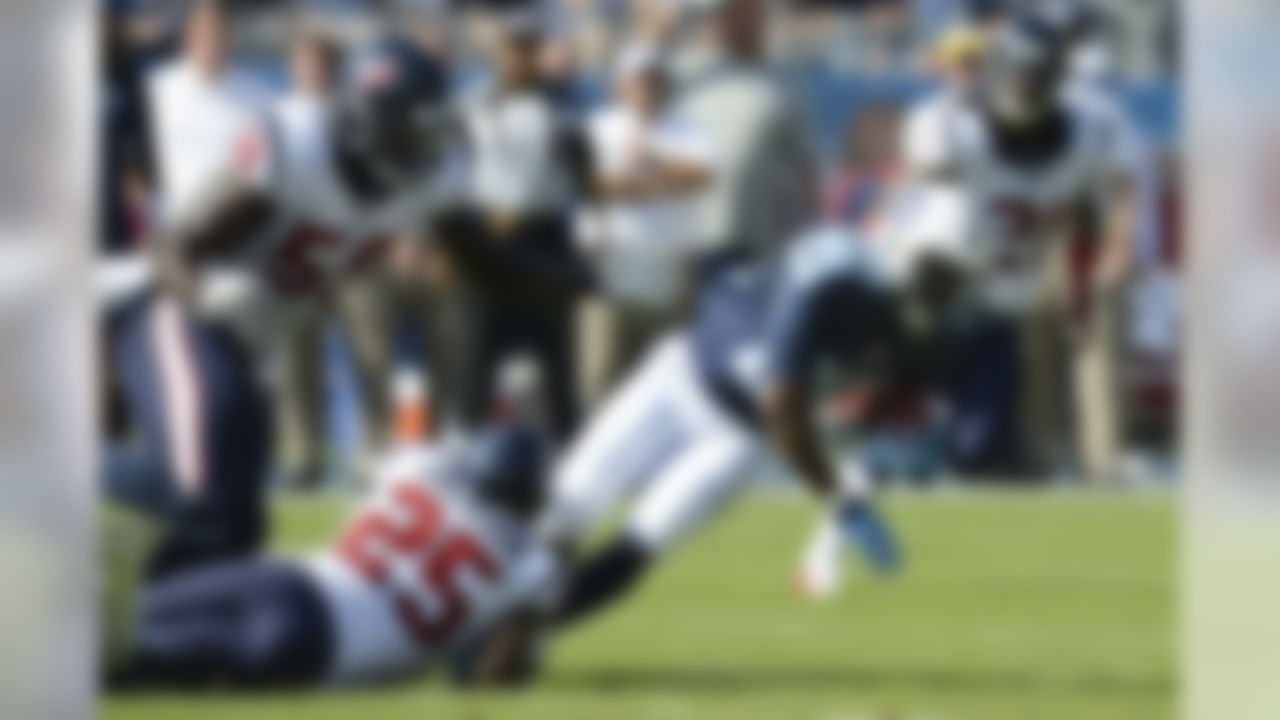 Tennessee Titans running back Leon Washington (29) is brought down by Houston Texans cornerback Kareem Jackson (25) in the first quarter of an NFL football game Sunday, Oct. 26, 2014, in Nashville, Tenn. (AP Photo/Mark Zaleski)