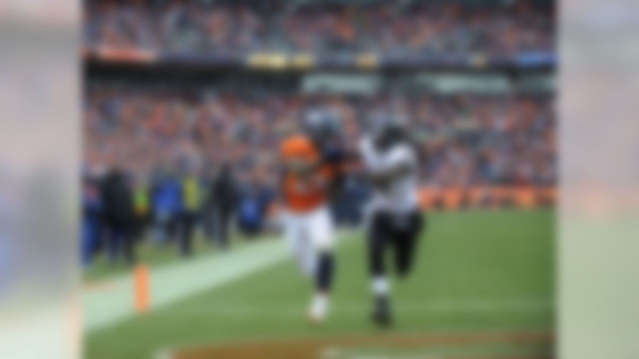 Denver Broncos running back Knowshon Moreno (27) catches a touchdown pass against Baltimore Ravens inside linebacker Dannell Ellerbe (59) in the second quarter of an AFC divisional playoff NFL football game, Saturday, Jan. 12, 2013, in Denver. (AP Photo/Jack Dempsey)