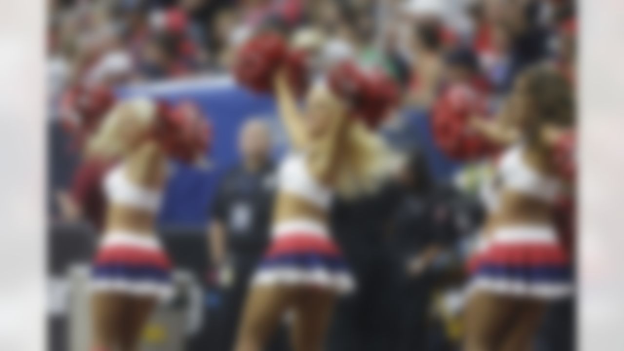 Houston Texans cheerleaders perform during the first quarter of an NFL football game, Sunday, Sept. 28, 2014, in Houston. (AP Photo/Patric Schneider)