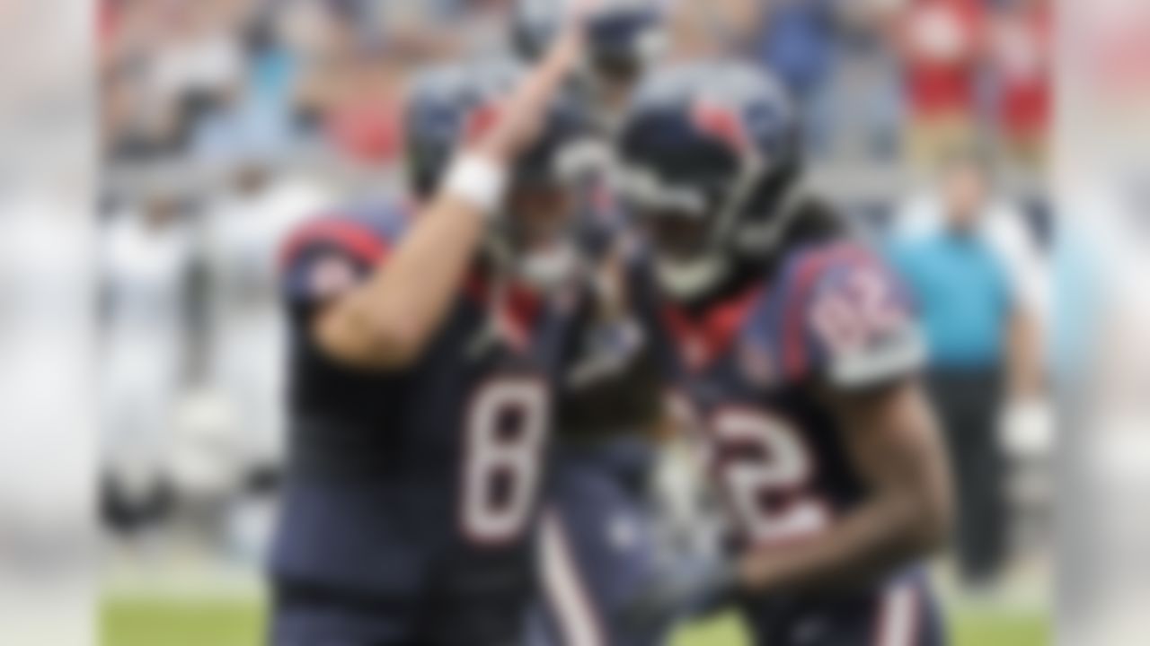 Houston Texans quarterback Matt Schaub (8) and Keshawn Martin (82) celebrates a touchdown during the first quarter of an NFL football game against the Jacksonville Jaguars Sunday, Nov. 18, 2012, in Houston. (AP Photo/Dave Einsel)