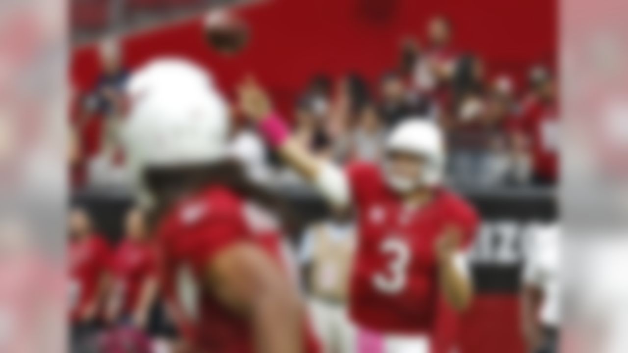 Arizona Cardinals quarterback Carson Palmer (3) warms up before an NFL football game against the Washington Redskins, Sunday, Oct. 12, 2014, in Glendale, Ariz. (AP Photo/Rick Scuteri)