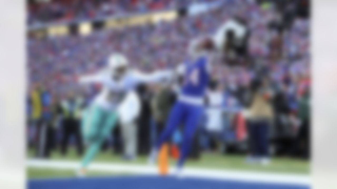 Buffalo Bills wide receiver Stefon Diggs (14) tries to make a catch as he is defended by Miami Dolphins cornerback Xavien Howard (25) during an NFL Super Wild Card Weekend playoff game on Sunday, January 15, 2023 in Orchard Park, New York.
