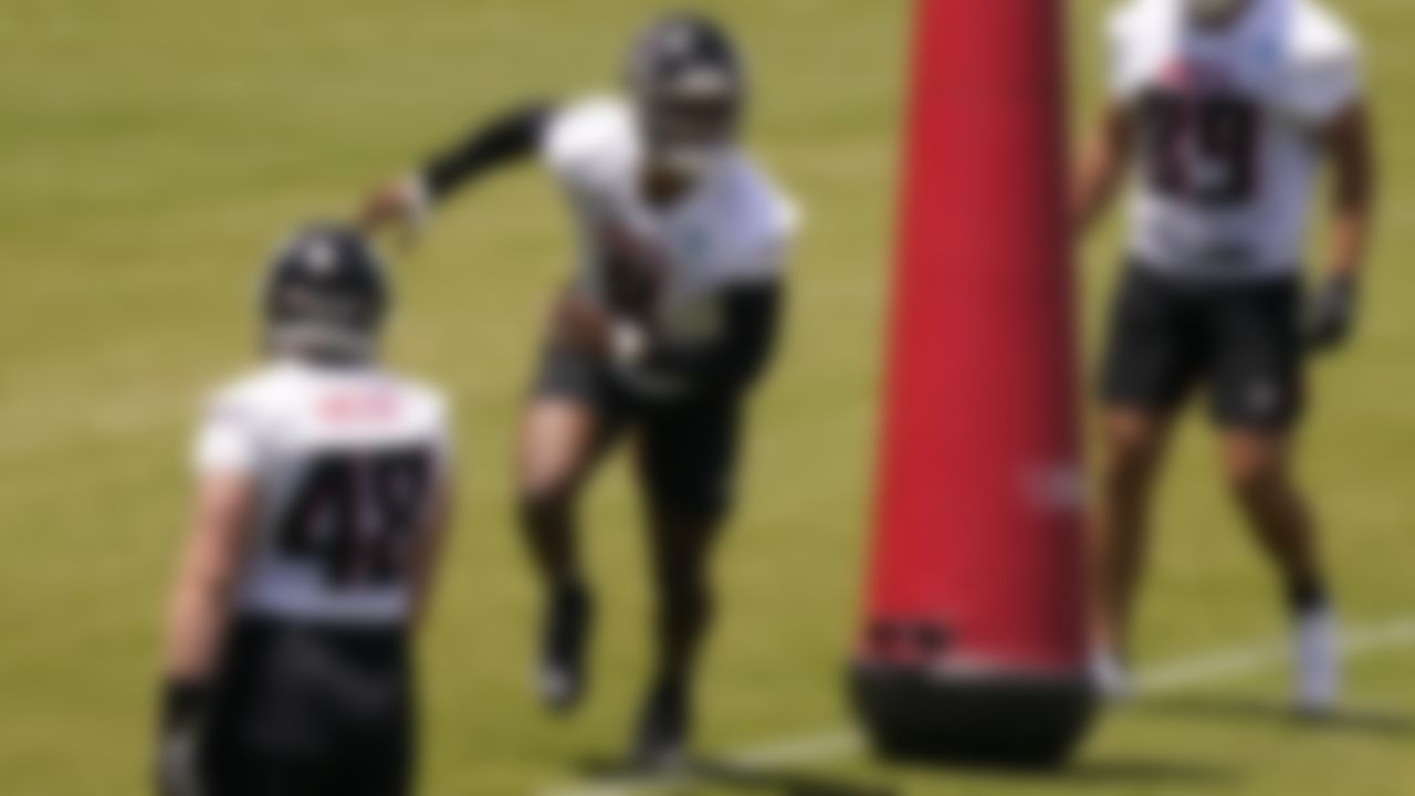 Atlanta Falcons' Kyle Pitts, center, runs drills during an NFL football rookie minicamp on Friday, May 14, 2021, in Flowery Branch, Ga.