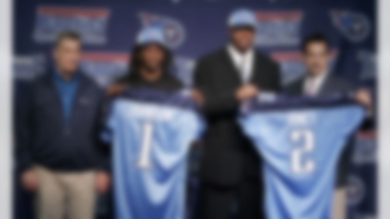Tennessee Titans first-round draft pick, running back Chris Johnson, second from left, and second-round pick, defensive lineman Jason Jones, second from right, are introduced by general manager Mike Reinfeldt, left, and head coach Jeff Fisher, right, in Nashville, Tenn., Sunday, April 27, 2008. (AP Photo/Mark Humphrey)