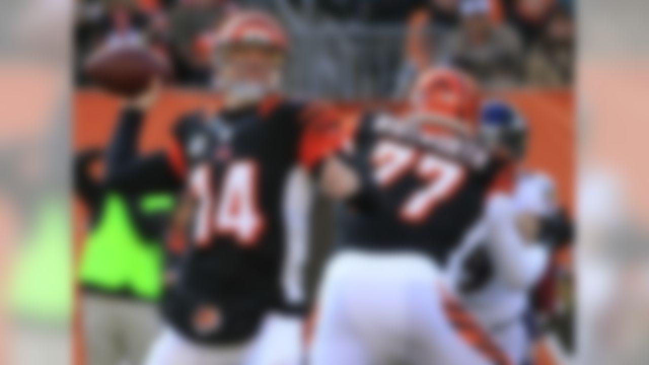 Cincinnati Bengals quarterback Andy Dalton (14) passes against the Baltimore Ravens in the first half of an NFL football game on Sunday, Dec. 30, 2012, in Cincinnati. (AP Photo/Tom Uhlman)