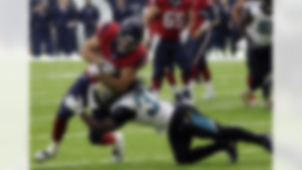 Houston Texans tight end Ryan Griffin (84) is tackled by Jacksonville Jaguars' Johnathan Cyprien (37) during the second half of an NFL football game Sunday, Dec. 18, 2016, in Houston. (AP Photo/David J. Phillip)