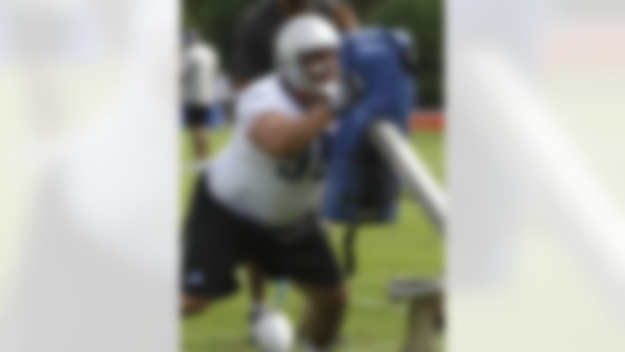 Detroit Lions defensive tackle Quinn Pitcock hits a tackling sled during drills at the NFL football team's training camp in Allen Park, Mich., Thursday, Aug. 4, 2011. (AP Photo/Carlos Osorio)