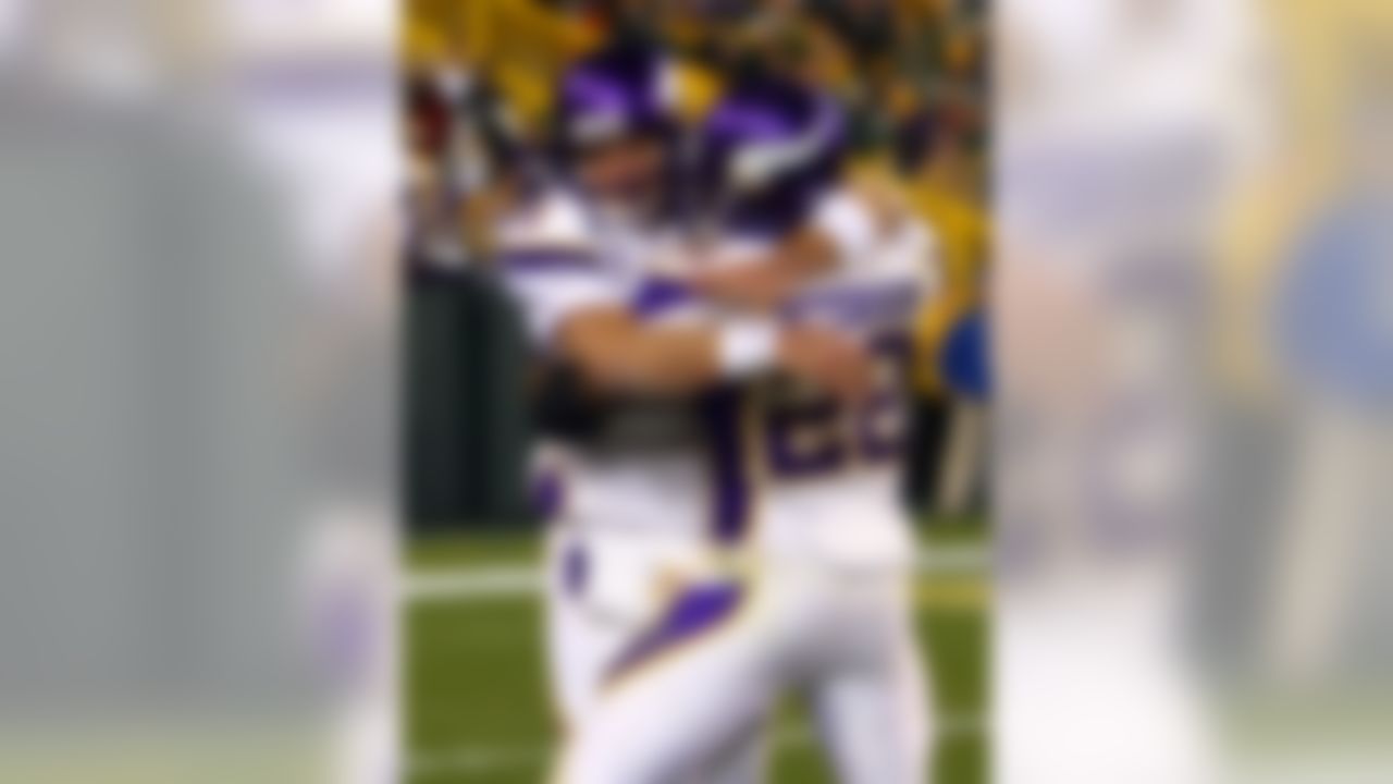 Brett Favre of the Minnesota Vikings walks off the field against