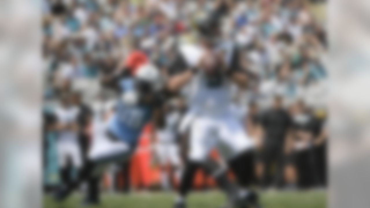 Jacksonville Jaguars quarterback Blake Bortles, right, looks for a receiver as he is pressured by Tennessee Titans outside linebacker Brian Orakpo (98) during the first half of an NFL football game, Sunday, Sept. 17, 2017, in Jacksonville, Fla. (AP Photo/Phelan M. Ebenhack)