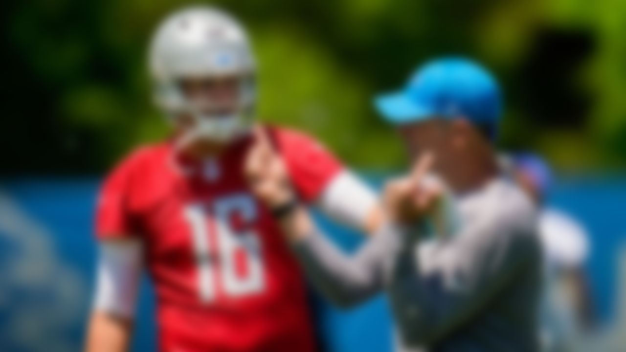 Detroit Lions quarterback Jared Goff listens to quarterbacks coach Mark Brunell in Allen Park, Mich., Thursday, May 27, 2021.
